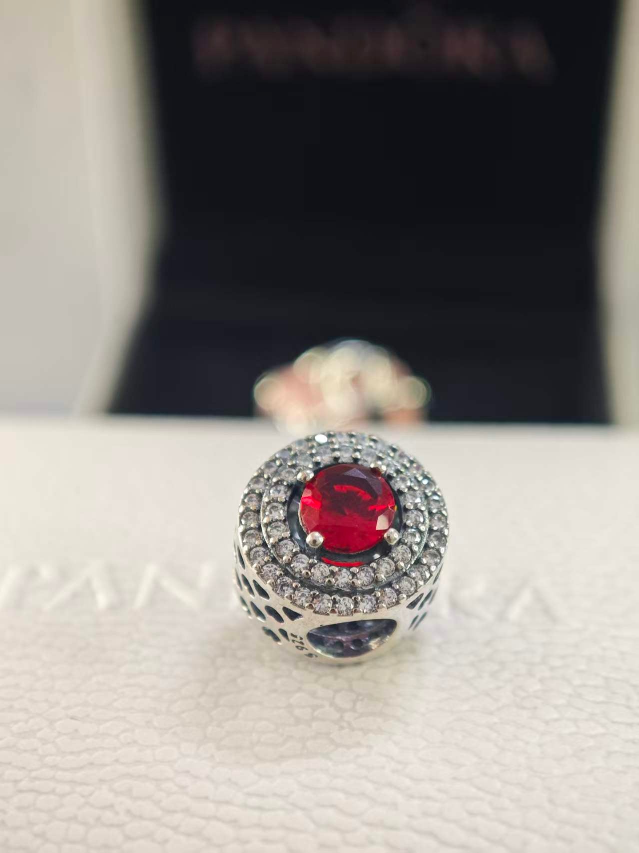 Red Sparkling Levelled Round Charm