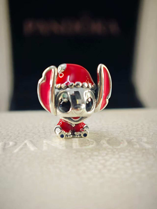 Disney Stitch wearing a Santa hat and squatting Charm
