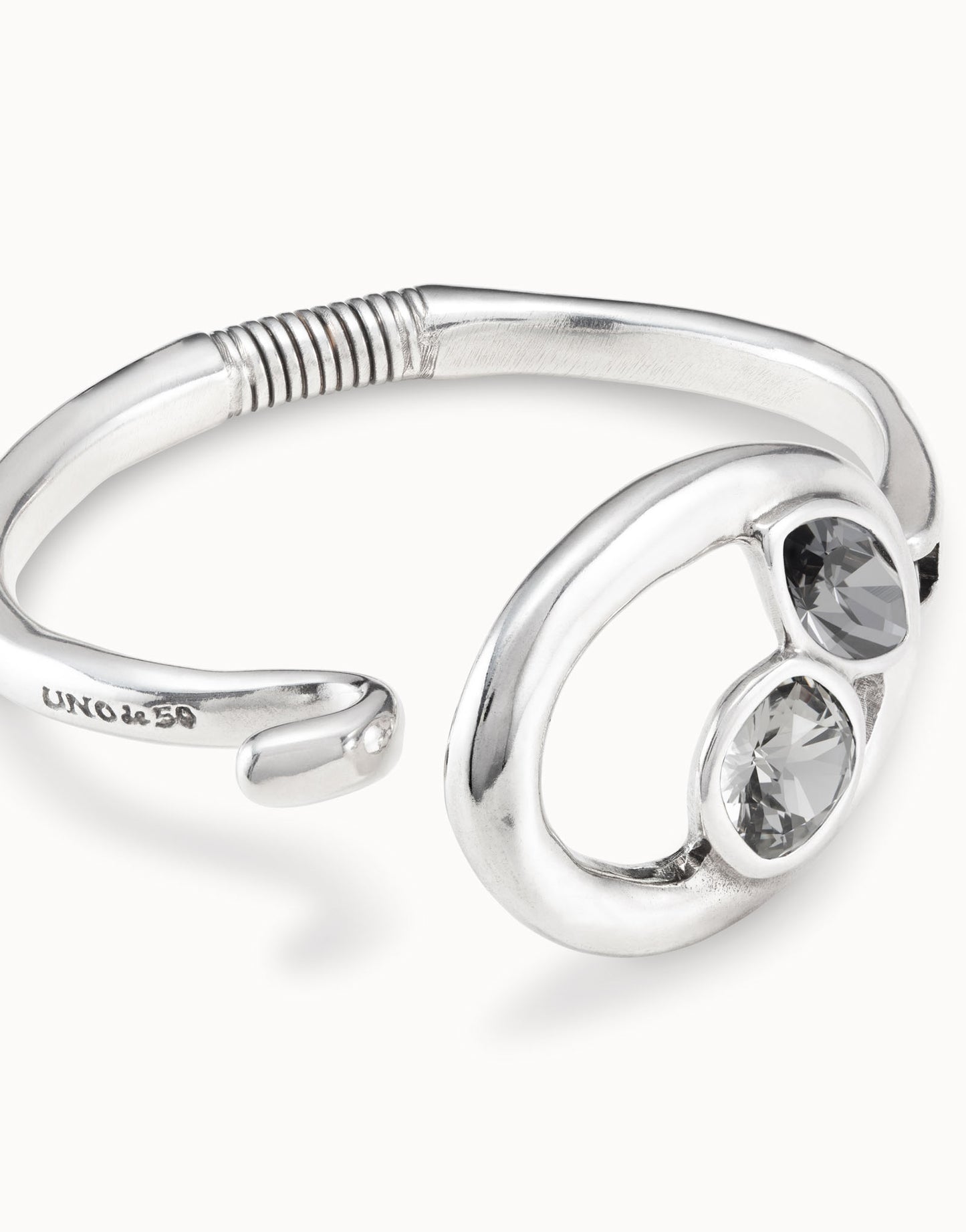 Silver bracelet with silver and greenish gray crystals